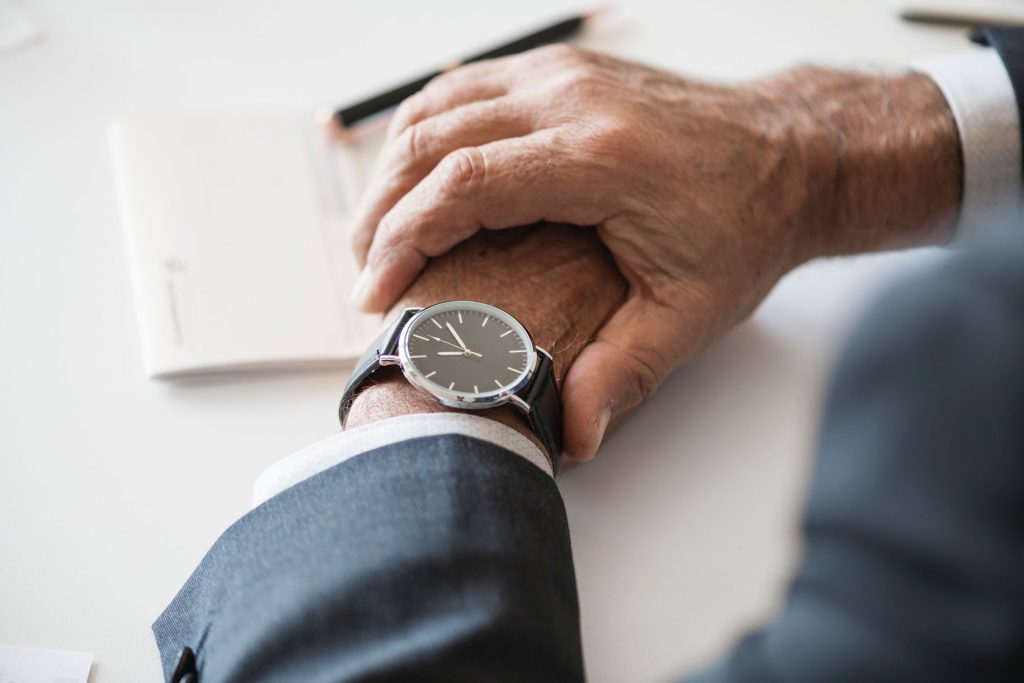 man looking at his watch