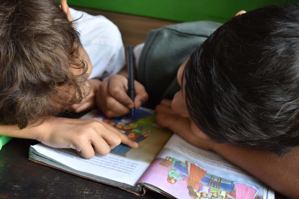 children reading a book