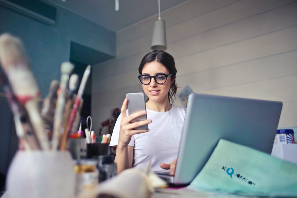 Woman looking at her phone or possibly taking a picture