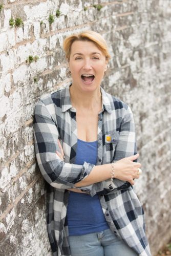 Jo Howarth by a brick wall